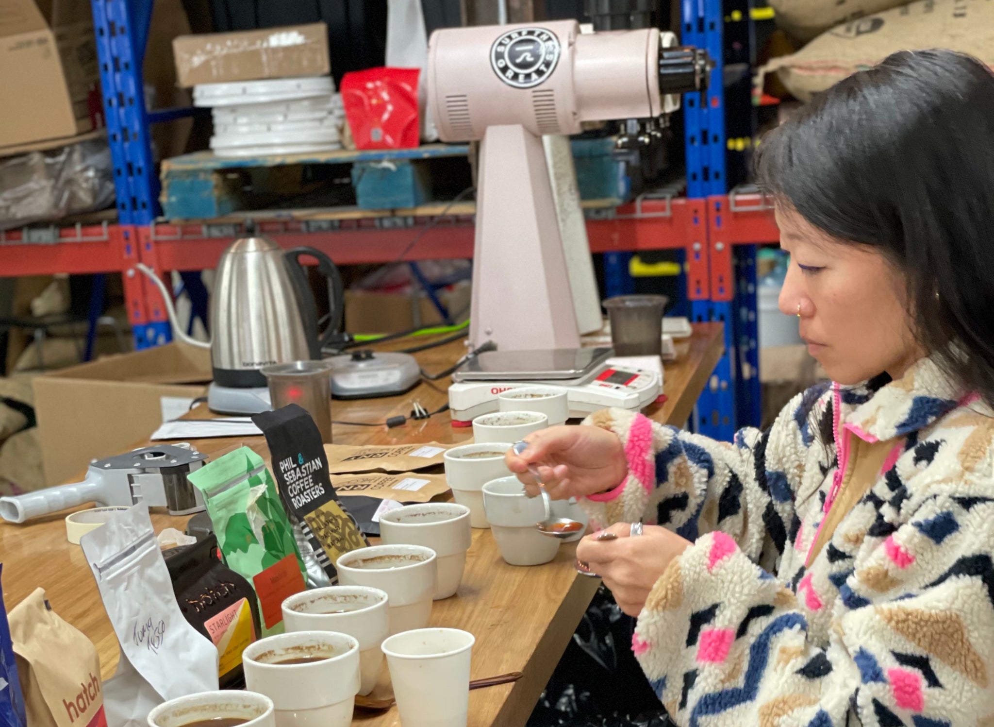 Melanie Leeson cupping coffee from different roasters