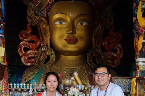 Kunga and Dhondup in front of Maitreya Buddha statue