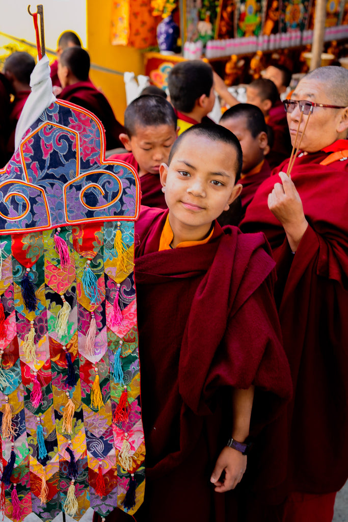 Novice monk with victory banner