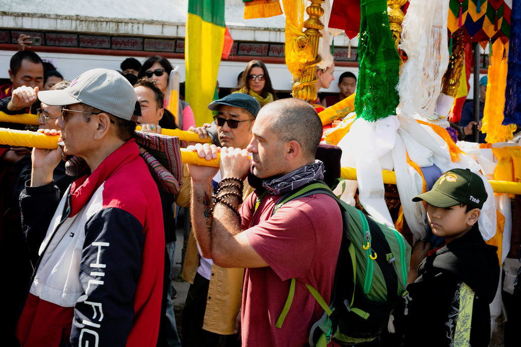 Devotees holding Buddha Maitreya palanquin