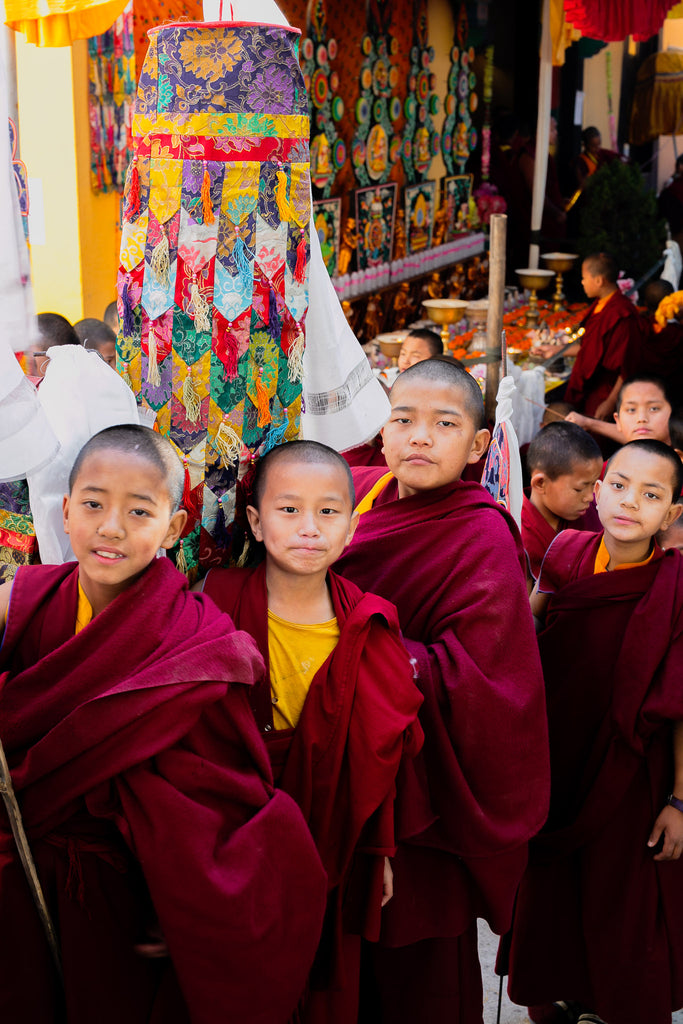 Novice monks with victory banner at end of parade