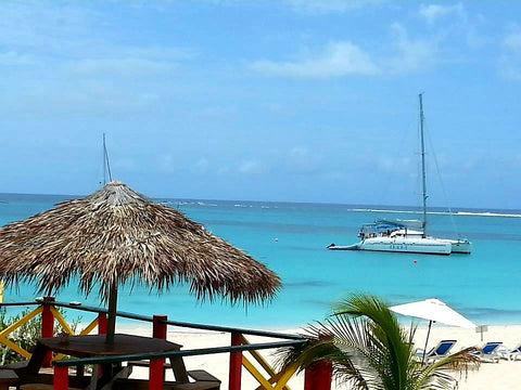 Australian Cricket Tours - Our Beautiful Catamaran Sits In The Distance On The Turquoise Waters Of Prickly Pear, Anguilla