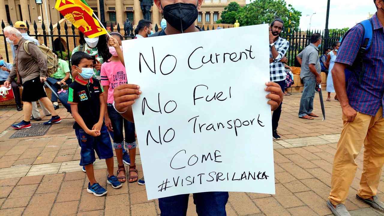 Anti-Government Protestor In Sri Lanka Hold A Sign Saying 'No Current' 'No Fuel' 'No Transport' 'Come Visit Sri Lanka' | Colombo | Sri Lanka | Australian Cricket Tours