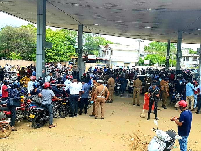 Hundreds Of People Anxiously Wait Their Turn For Fuel At A Petrol Station In Sri Lanka