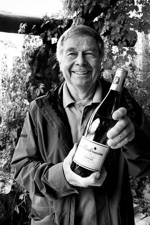 Martin Malivoire, Owner, with back vintage of Moira Chardonnay