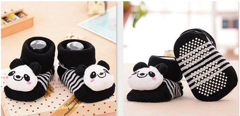 pair of socks with fabric panda head sewn on top