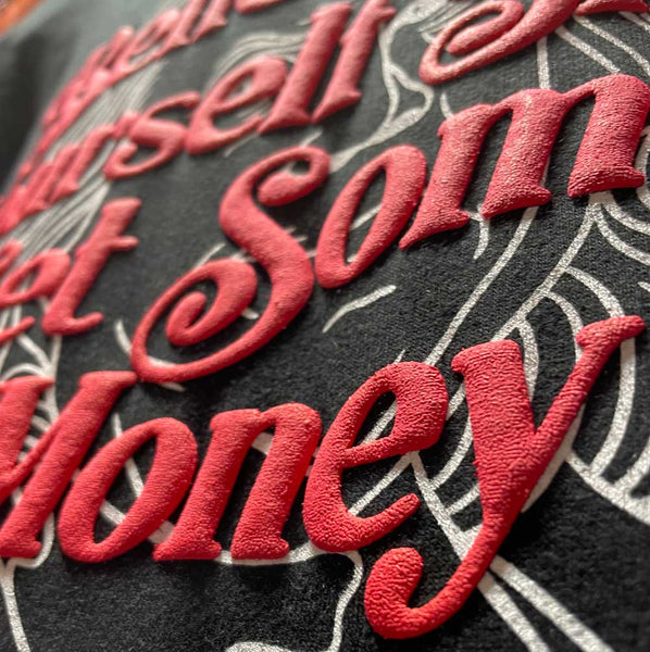 3d puff print by constantly create shop showing a white underbase with red 3d puff ink on the top most layer of the artwork of a black hoodie sample