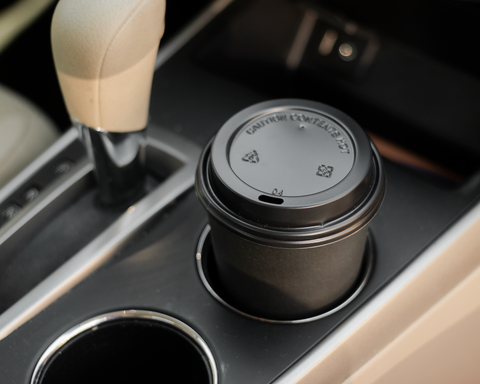 Coffee cup in car cup holder