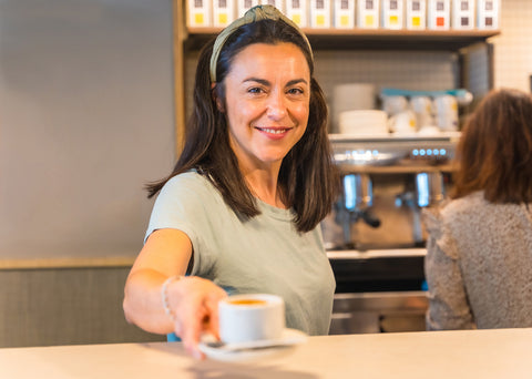 Image of a female offering coffee