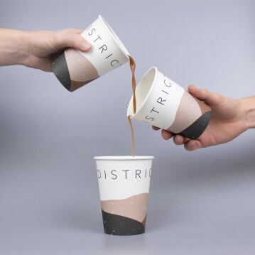 Cups pouring into each other. Trendy and fun customized coffee cup. Hot cup factory has every product you need for your cafe, work with a professional designer for FREE to customize your coffee shop with hot cup factory today! 