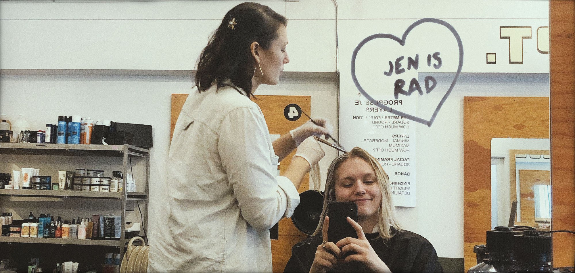 Photo of Jen bleaching Bekah's hair