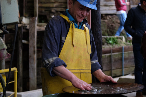 Fairmined Gold miner panning for gold
