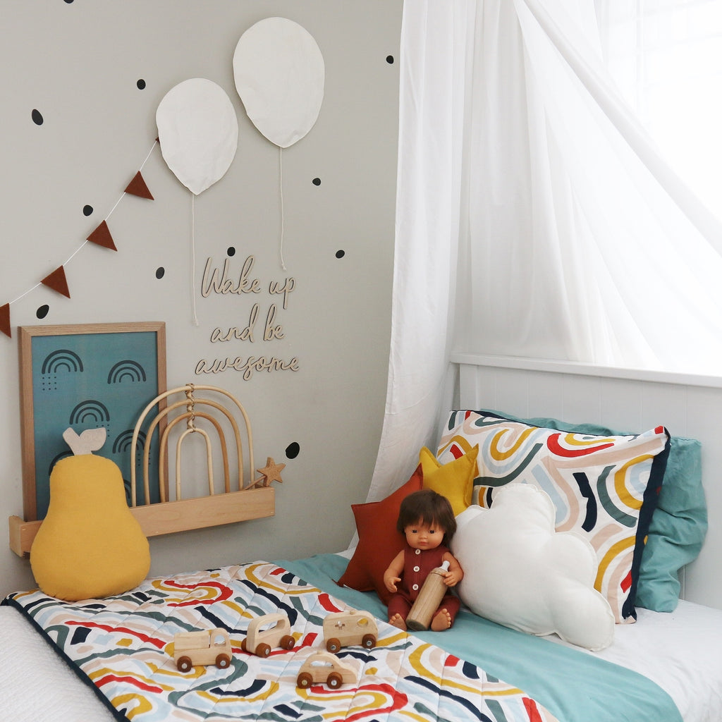 A  Colourful Kids' Room with bright bedspread and wooden toys 