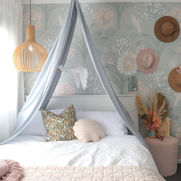 light grey drape canopy hanging above double size bed in girls bedroom