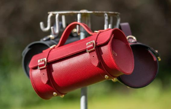 Cambridge Satchel Co.'s take on The Bowls Bag created with beautiful red leather hanging with other bowls bags