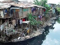 An impoverished shack near some water