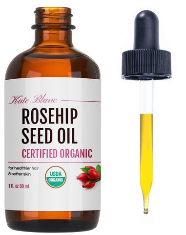 amber bottle of rosehip oil with dropper 