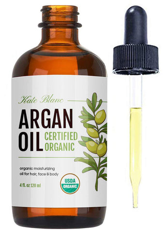 amber bottle of argan oil with dropper
