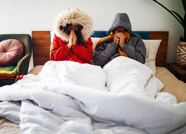 cold couple in bed