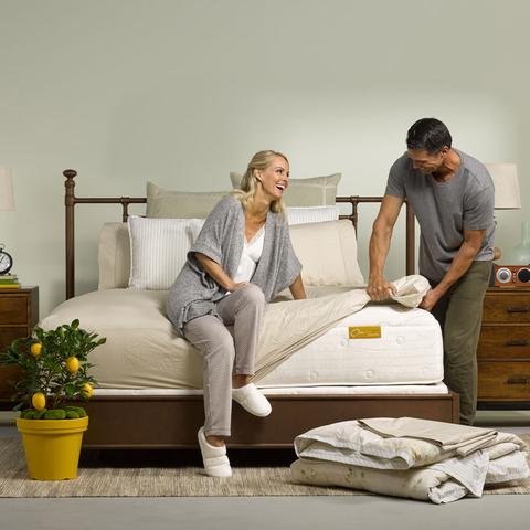 Couple adds new linens to bed