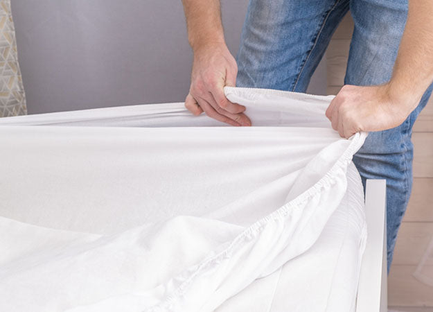 pulling sheet over mattress