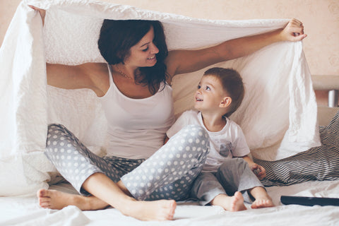 Mom and Son cuddling under the blanket