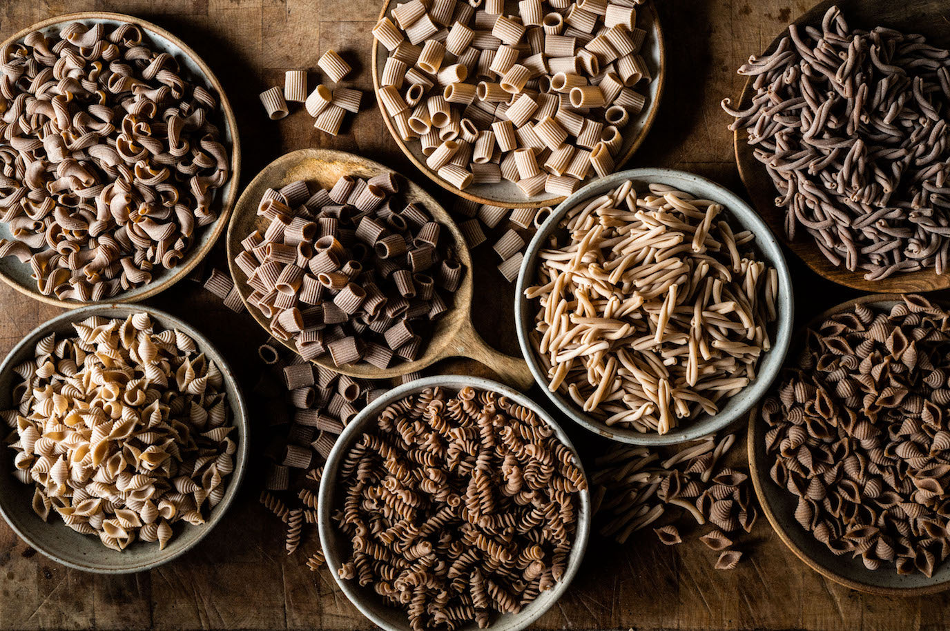 Pasta grains on a wooden board