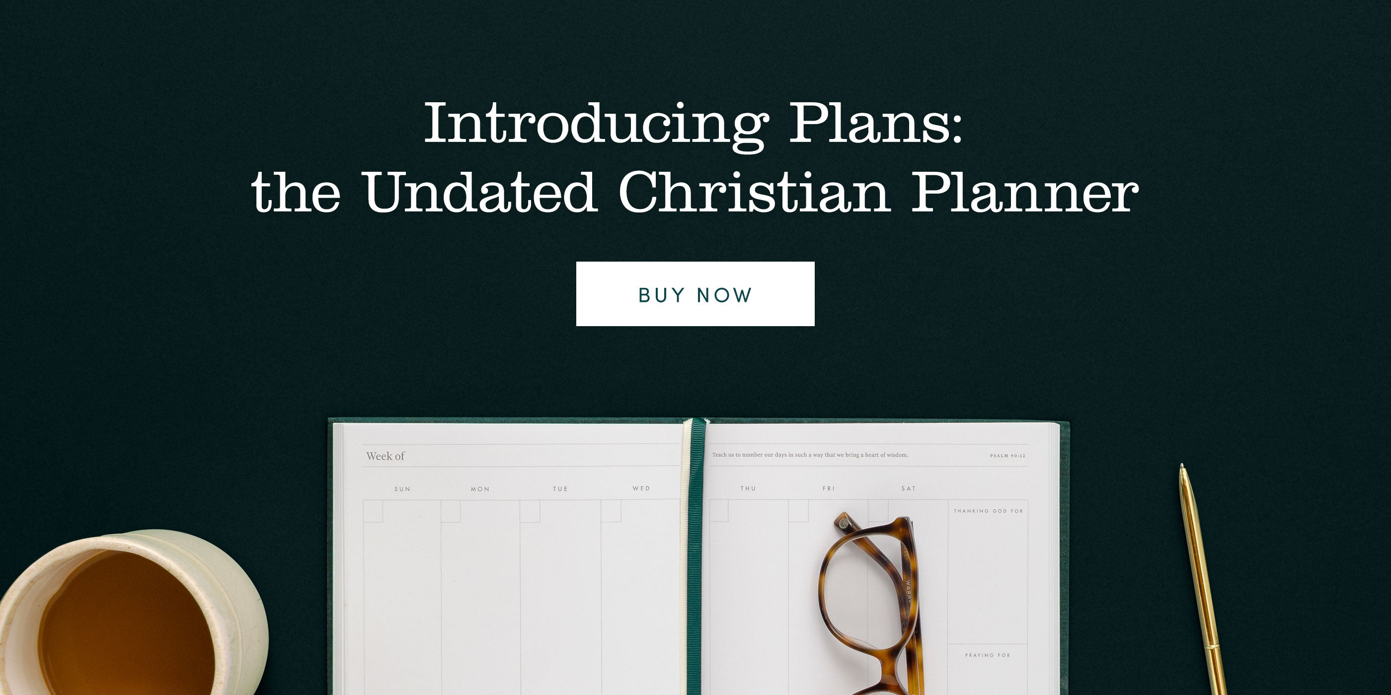 Introducing Plans: the Christian Undated Planner. Desk scene with cup of coffee, open planner, glasses, and a brass pen.