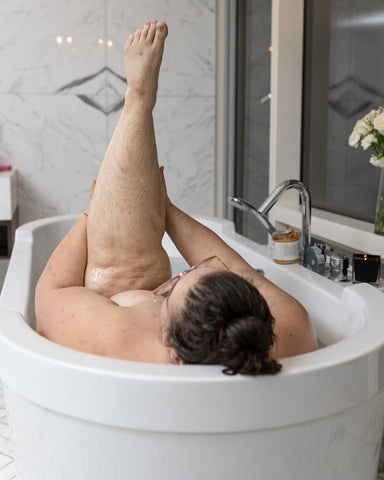 plus-sized-woman-luxuriating-inBuck-Naked-Soap-Company-bath-products-with-her-unshaved-legs-in-the-air