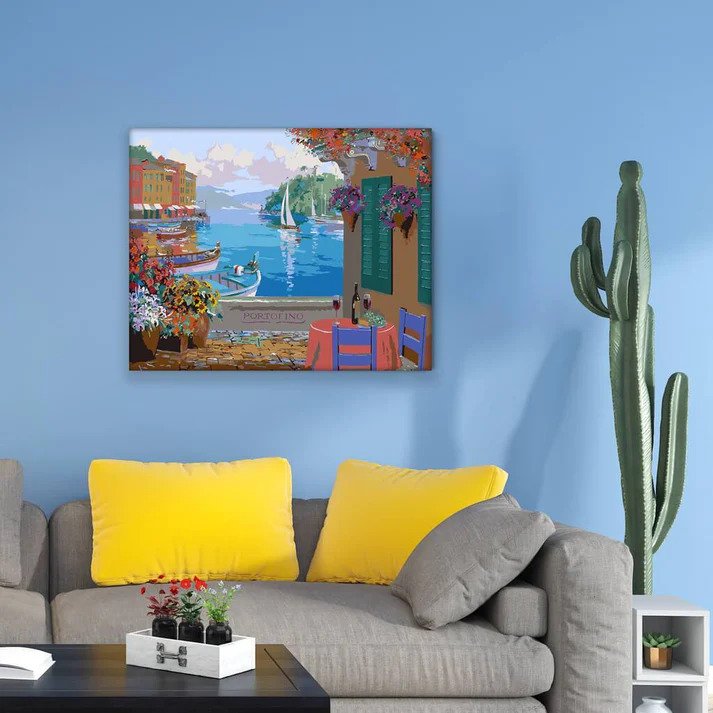 a painting of Portofino hanging on a wall in a living room