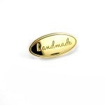 Oval Metal Bag Label "handmade" - Gold Finish with washer