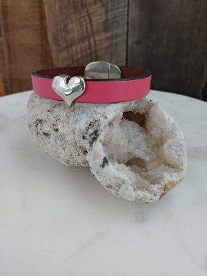 Bubblegum pink fine Italian leather is accented with a shiny silver heart. An oval magnetic clasp secures the bracelet.