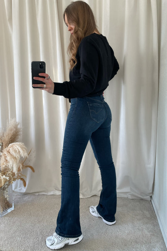 High | Højtaljede jeans til damer →