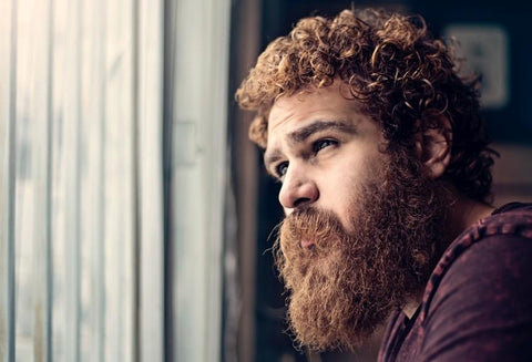 red-haired man with curly beard and hair