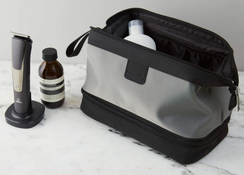 grey aberlite travel bag with aesop bottle and aberlite trimmer
