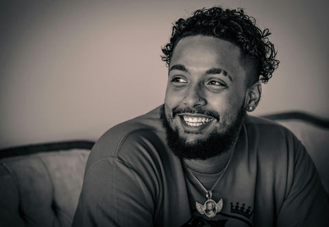 man with curly beard in greyscale