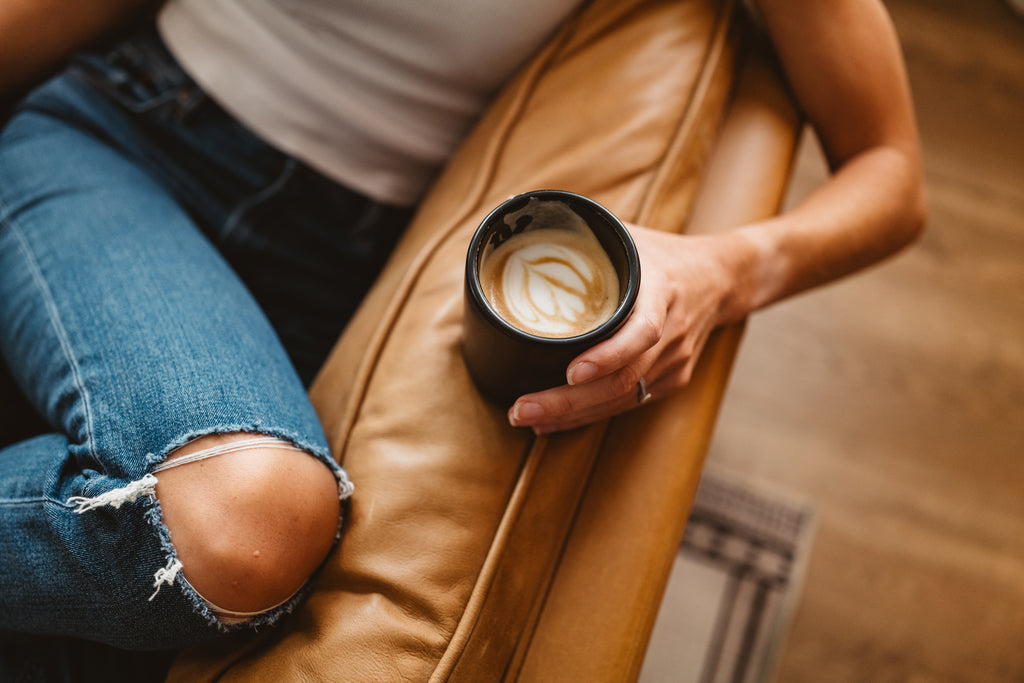 person holding a latte lifestyle by ben matthews