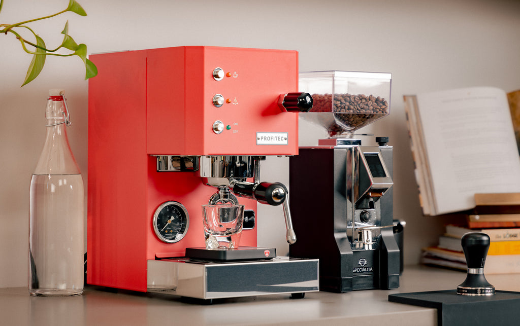 profitec go espresso machie in red with eurkea mignon specialita grinder in black lifestyle photo by clive coffee