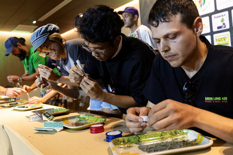 People competing in a weed joint rolling competition