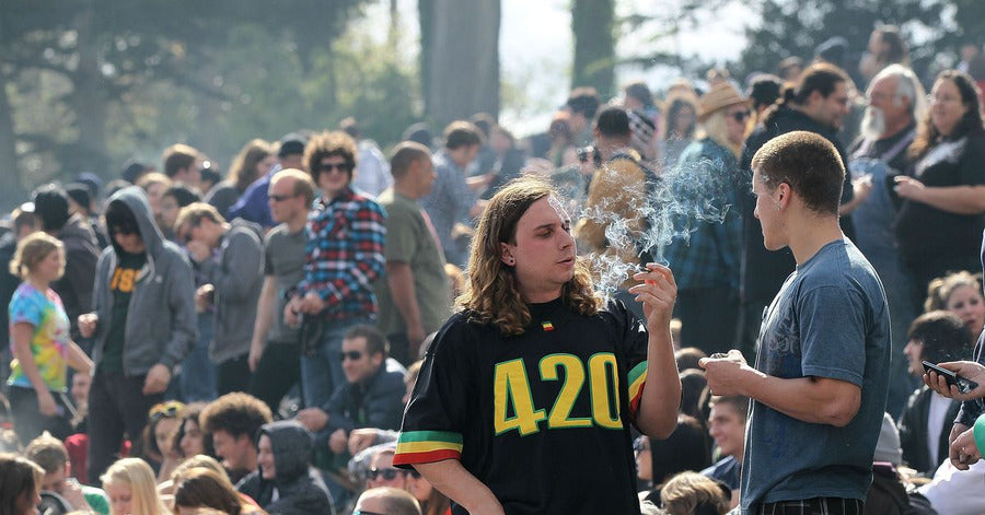 People smoking together at an outdoor 420 event