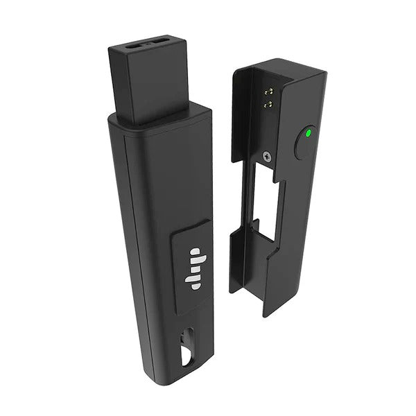 A black EVRI weed pen battery stands next to its multi-purpose attachment for pods.