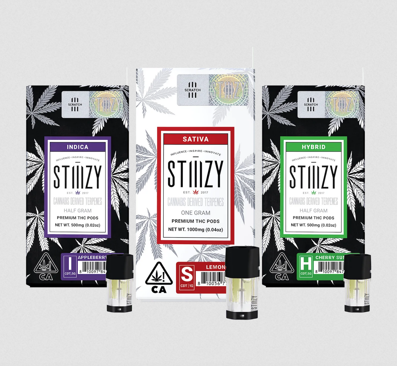 Vape pods with cannabis-derived terpenes stand in front of three STIIIZY packages.