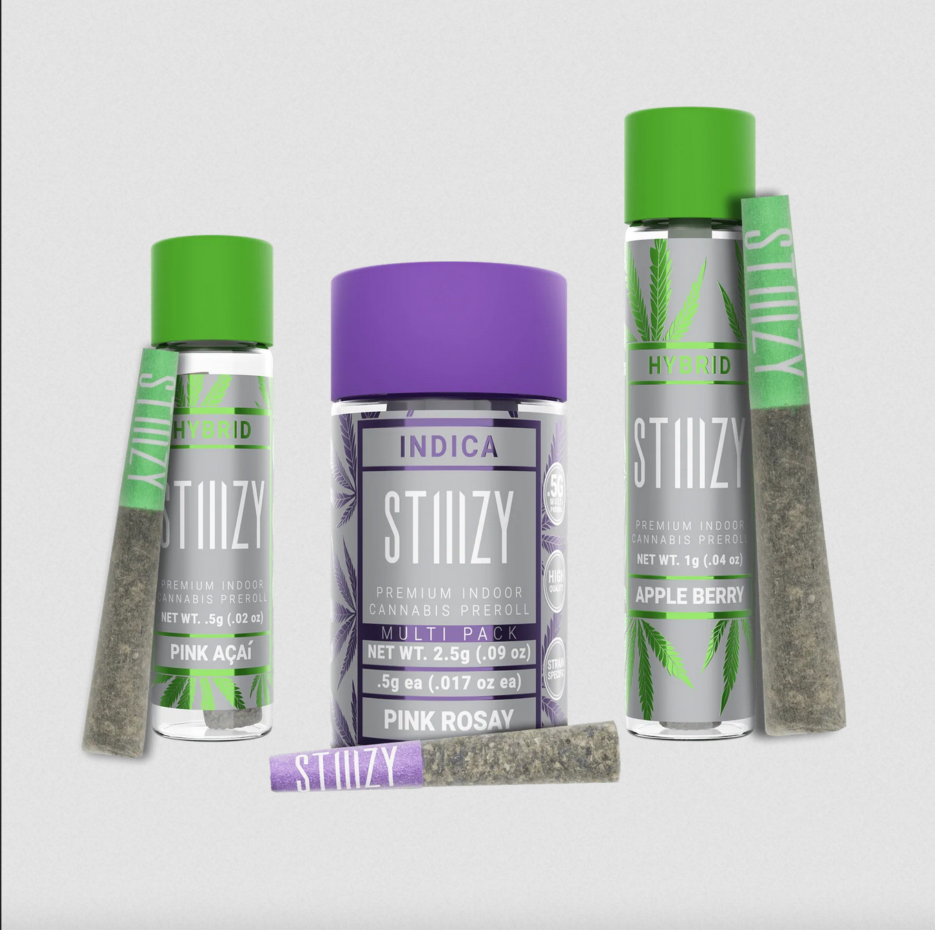 Pre-rolls with premium hybrid or indica cannabis flower stand or lie next to their jars.
