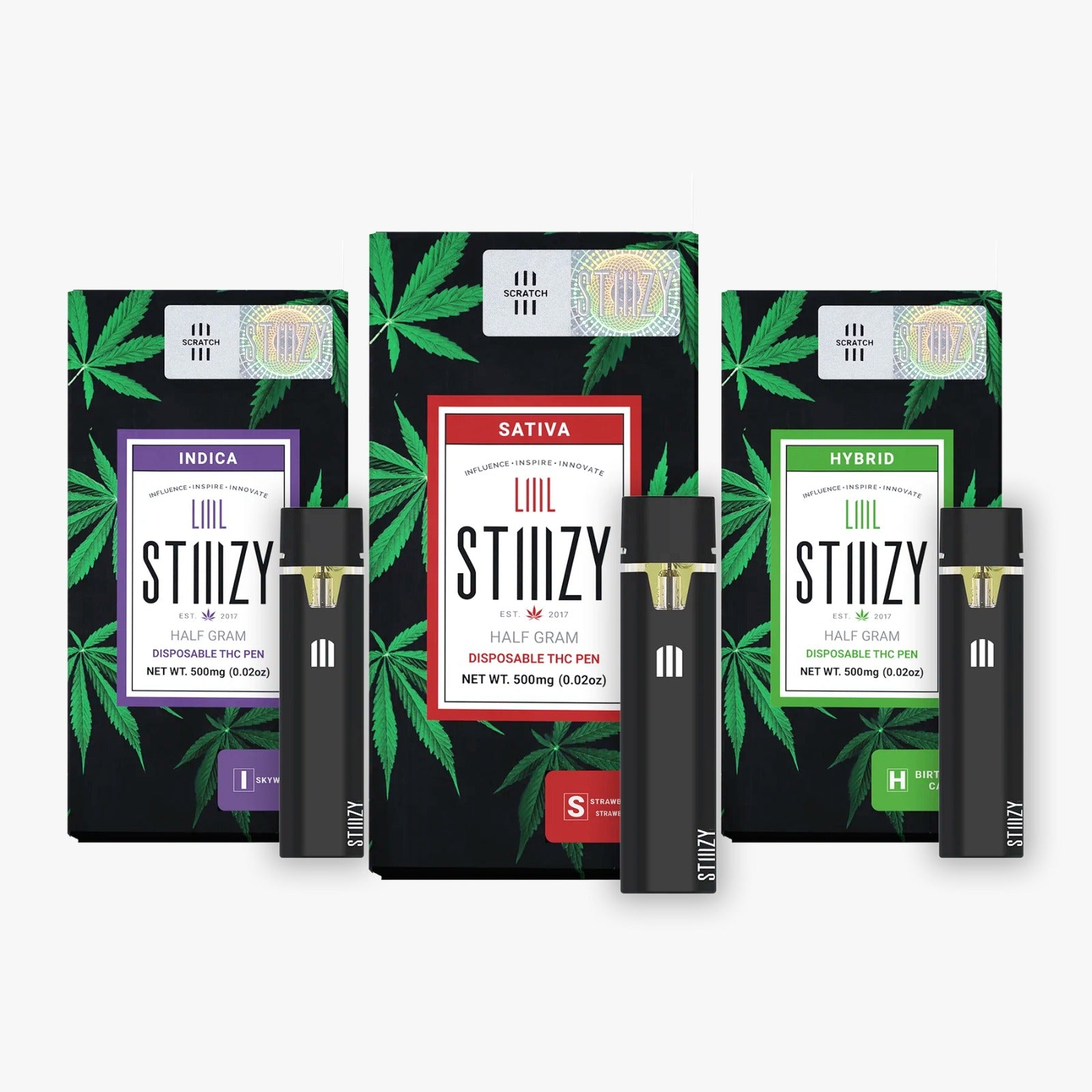 Three disposable all-in-one weed pens from STIIIZY stand next to their packages.