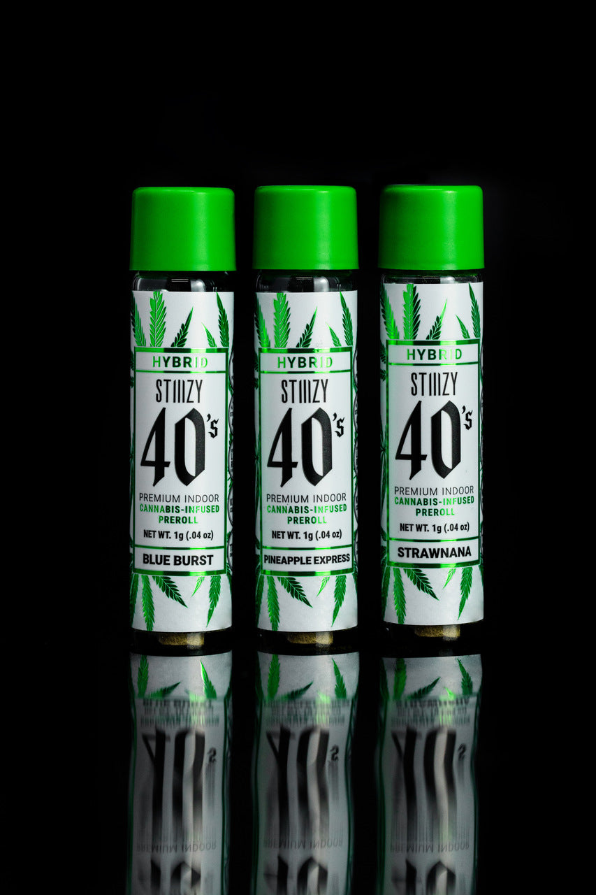 Three green-capped jars hold infused pre-rolls made with cannabis flower and extracts.