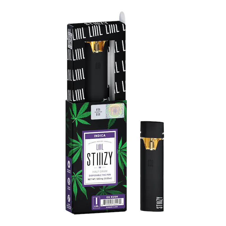 Two weed pens carrying distillate derived from the OG Kush strain are showcased with their black, green, and purple box.