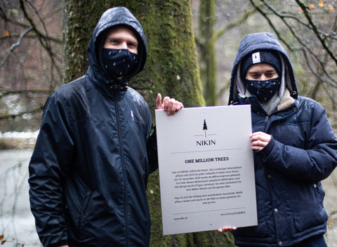 The two founders with the sign