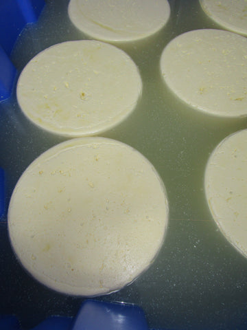 Fresh cheese getting a brine bath