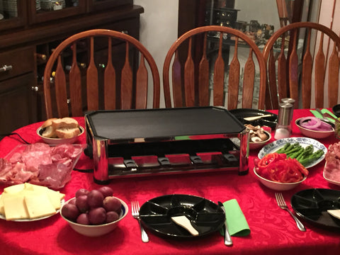 Dining table with Raclette grill waiting for the guests
