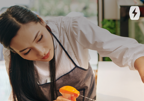 A woman sprays a cleaner